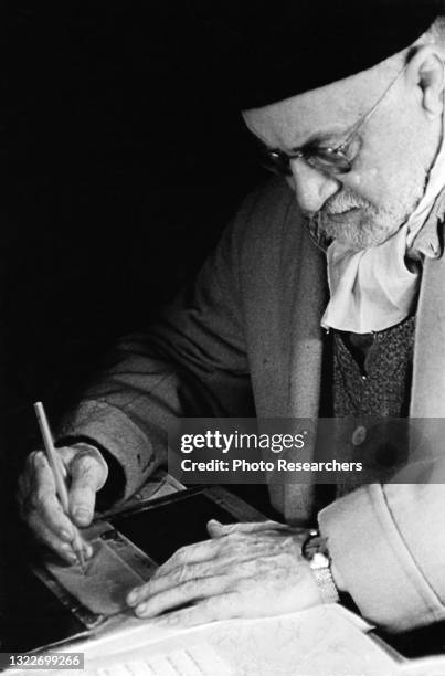 View of French artist Henri Matisse as he draws, Paris, France, 1948.