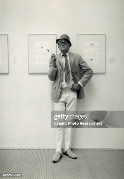 Portrait of British Pop artist David Hockney as he poses, during his one man show, 'Drawings For Ubu Roi and Cavafy Etchings,' at John Kasmin...