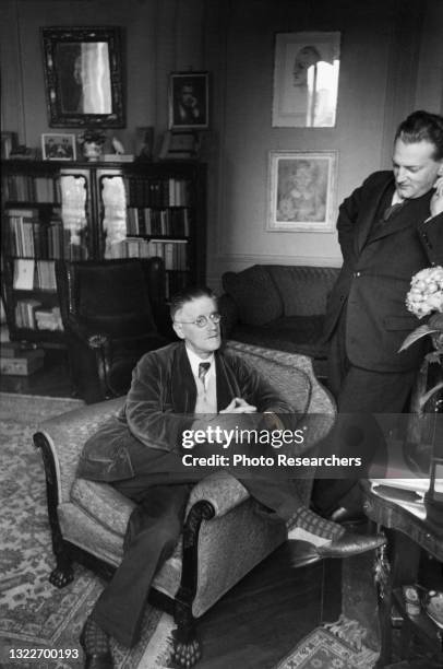 View of Irish author James Joyce as he speaks with American editor and critic Eugene Jolas , Paris, France, 1938.
