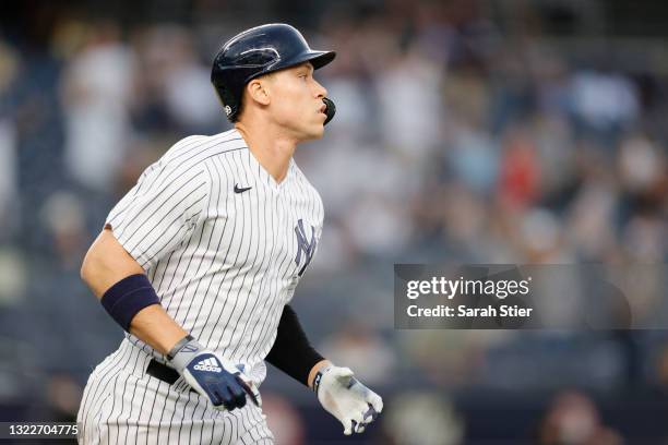 Aaron Judge of the New York Yankees watches the ball fly out of the park after hitting a home run during the third inning of Game Two of a...
