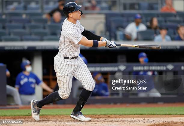 Aaron Judge of the New York Yankees watches the ball fly out of the park after hitting a home run during the third inning of Game Two of a...