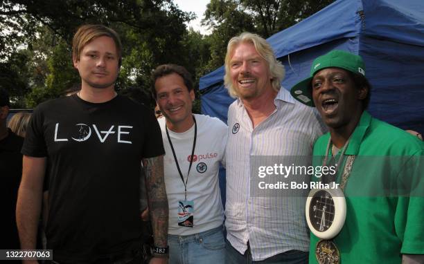 Sir Richard Branson, Virgin Group, coo and Dan Schulman, ceo Virgin Mobile USA pose with Blink-182 lead Tom DeLonge and Public Enemy's Flavor Flav at...