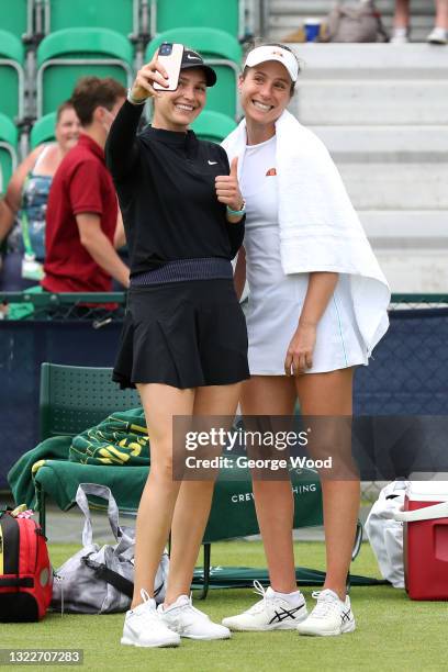 Johanna Konta of Great Britain and Donna Vekic of Croatia take a selfie after victory against Sabrina Santamaria of United States and Lesley...