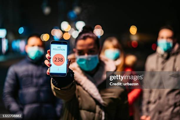 pollution app showing high air pollution - factory smog stock pictures, royalty-free photos & images