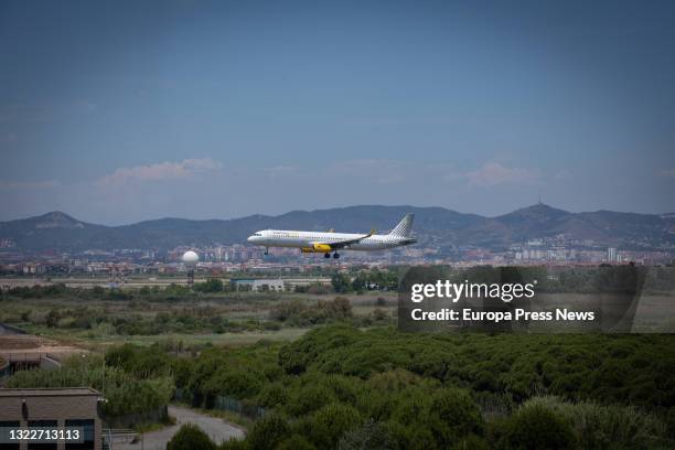 An airplane lands at Josep Tarradellas Barcelona-El Prat airport, near the natural protected area of La Ricarda, on June 9 in El Prat de Llobregat,...