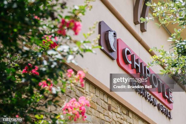 The exterior of a Chipotle Mexican Grill store is shown on June 09, 2021 in Houston, Texas. Menu prices at Chipotle Mexican Grill have risen by...