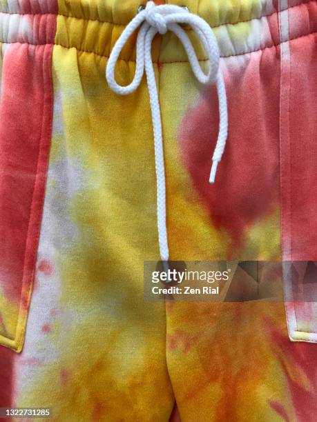 tie dye design on jogging pants with elastic and drawstring waist - jogging pants stock pictures, royalty-free photos & images