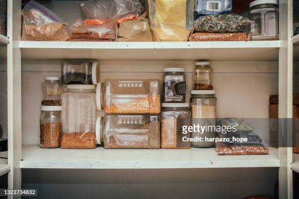pantry shelf with various dried goods. - food pantry stock pictures, royalty-free photos & images