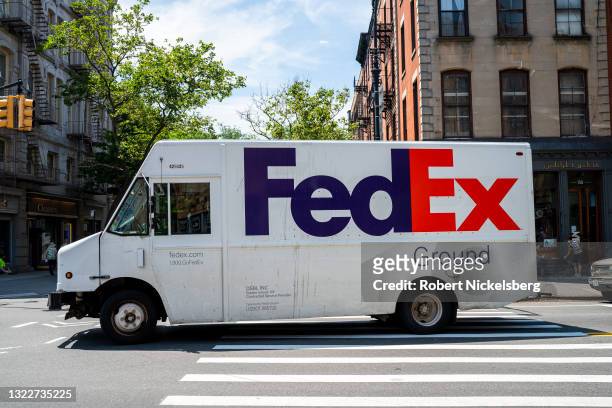 FedEx delivery truck enters an intersection on June 9, 2021 in the Brooklyn borough of New York City. New York City is currently in phase 4 of its...