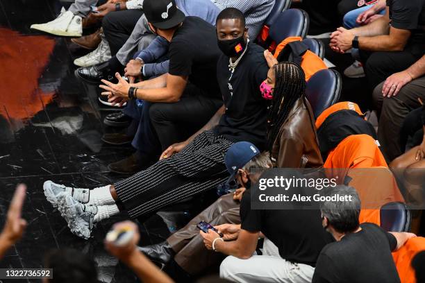 Utah Jazz owner Dwyane Wade sits with his wife Gabrielle Union during Game One of the Western Conference second-round playoff series against the LA...
