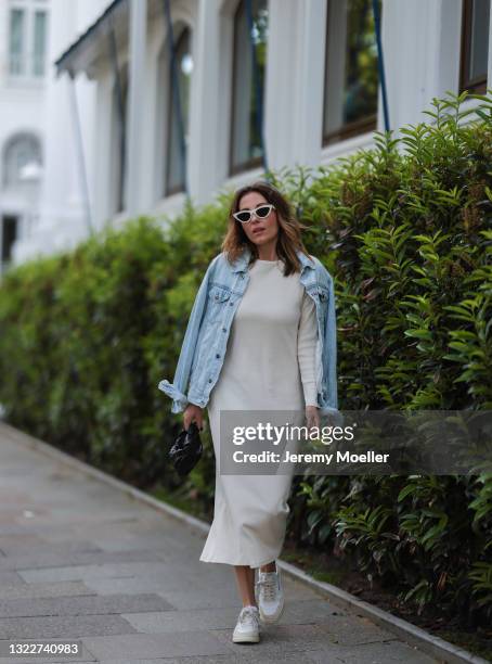 Elise Soho wearing beige Baige dress, blue Topman denim jacket, beige Autry sneakers and black Bottega Veneta mini leather bag on June 03, 2021 in...