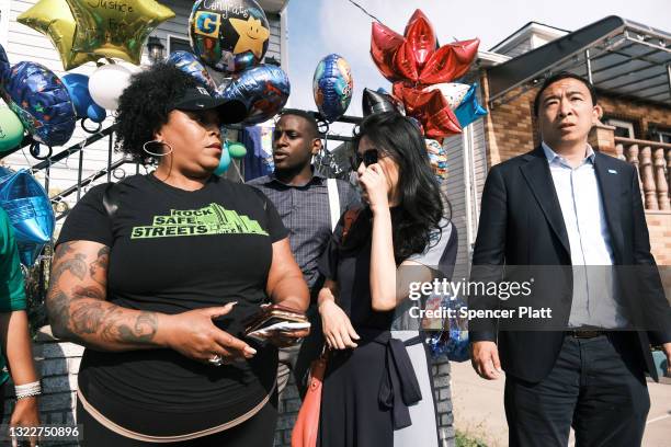 Mayoral candidate Andrew Yang is joined by his wife Evelyn Yang as they join activists, politicians and community members at a peace vigil to end gun...