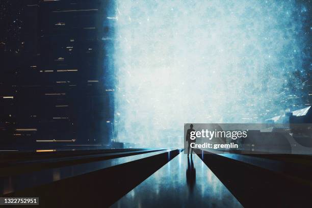 lonely woman walking in futuristic city at night - dystopian future city stock pictures, royalty-free photos & images