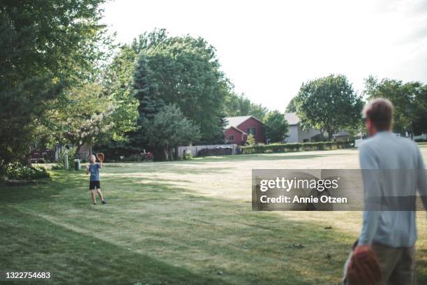 man and boy playing catch - playing catch stock pictures, royalty-free photos & images