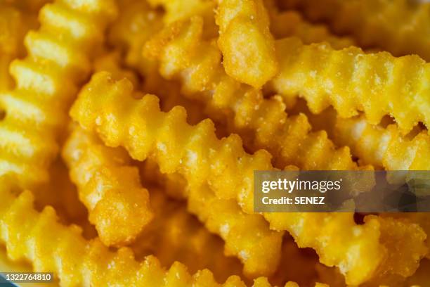 crinkle-cut french fries - scalloped pattern stock pictures, royalty-free photos & images