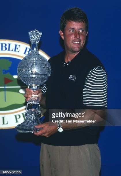 Phil Mickelson accepts the winning trophy during the AT&T Pebble Beach Pro Am on August 17, 1998 in Pebble Beach, California.