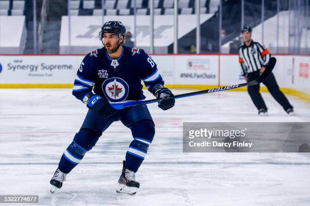 Mathieu Perreault of the Winnipeg Jets keeps an eye on the play during first period action against the Montreal Canadiens in Game Two of the Second...