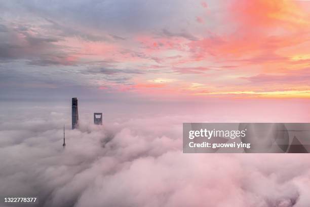 shanghai skyline in heavy fog - cloudscape buildings stock pictures, royalty-free photos & images