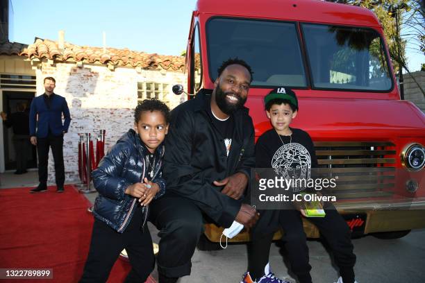 Baron Davis with Luke and Kingman attend the premiere of "Domino: Battle Of The Bones" on June 09, 2021 in Los Angeles, California.