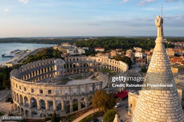 aerial view of sunset scene of pula city and the pula arena is a roman amphitheater located in pula, croatia - pula croatia stock pictures, royalty-free photos & images