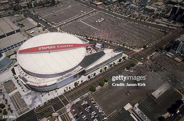 Crowds of Los Angeles Lakers fans wait outside the Staples Center during the Lakers'' NBA championship parade June 18, 2001 in Los Angeles.