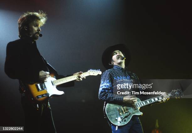 Ronnie Dunn and Kix Brooks of Brooks & Dunn perform at San Jose Arena on December 9, 1998 in San Jose, California.