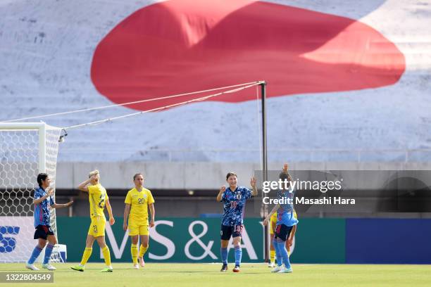 Yuzuho Shiokoshi of Japan celebrates scoring her side's fourth goal with her team mate Emi Nakajima during the women's international friendly match...