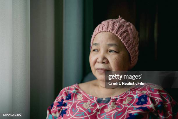 portrait of asian senior woman with cancer - senior loneliness stock pictures, royalty-free photos & images