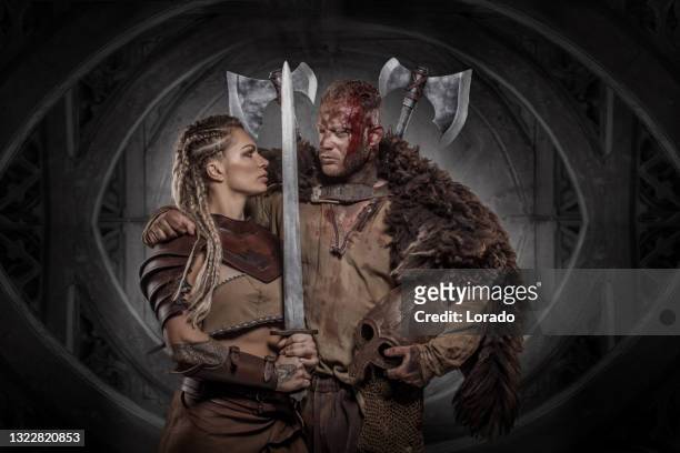 portrait of beautiful blonde fantasy viking couple - viking stock pictures, royalty-free photos & images