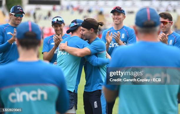 England batsman Rory Burns is embraced by team mate Ollie Pope in honour of his 25th cap before day one of the second Test Match between England and...