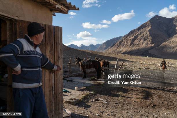 Ranger rides back after picking up a camera trap in the mountain range at Sarychat-Ertash State Nature Reserve on May 21 2021 in Issyk Kul,...