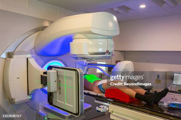 senior adult male undergoing radiotherapy for prostate cancer (real people) - radiotherapy stock pictures, royalty-free photos & images