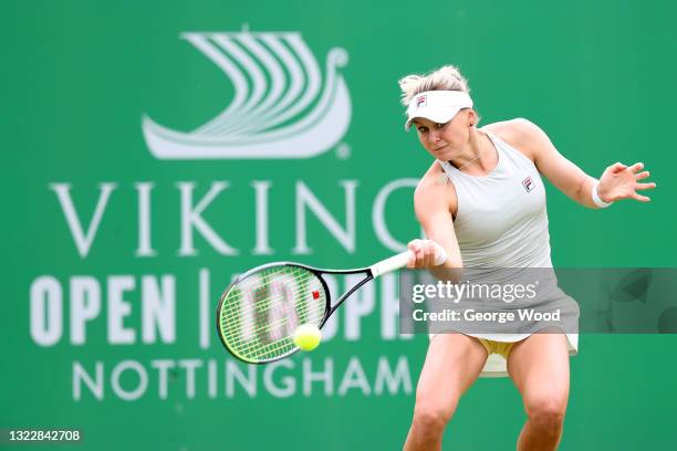 Kateryna Kozlova of Ukraine plays a forehand against Johanna Konta of Great Britain during the women's singles match on day six of the Viking Open at...