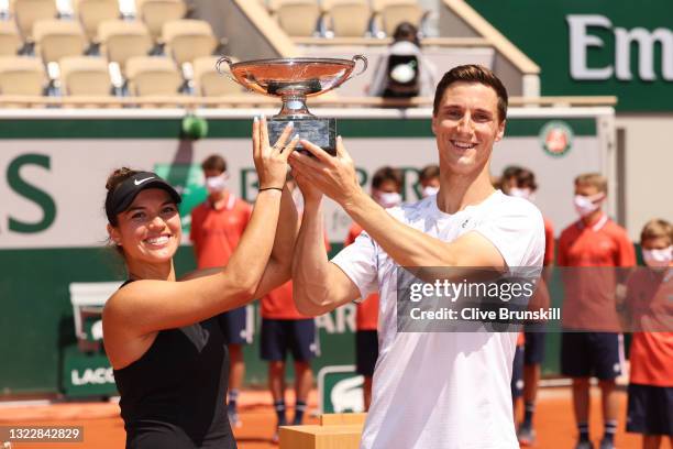 Desirae Krawczyk of The United States and playing partner Joe Salisbury of Great Britain pose with the trophy after winning their Mixed Doubles Final...