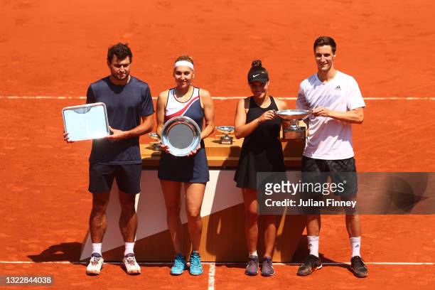 Runners-up Aslan Karatsev and Elena Vesnina of Russia and winners Desirae Krawczyk of The United States and Joe Salisbury of Great Britain pose with...