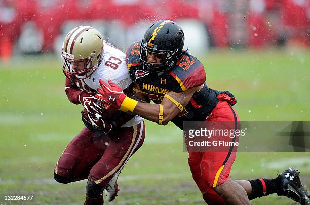 Darin Drakeford of the Maryland Terrapins tackles Alex Amidon of the Boston College Eagles at Byrd Stadium on October 29, 2011 in College Park,...