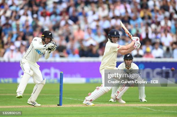 England opening batsman Dom Sibley drives towards the boundary watched by New Zealand wicketkeeper Tom Blundell during day one of the second Test...