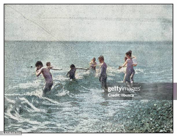 antique photo: at the beach - archival photos stock illustrations