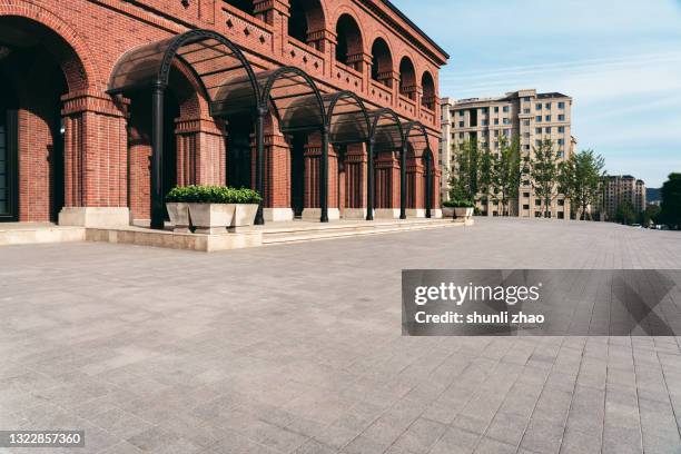 city square in front of modern buildings - block paving stock-fotos und bilder