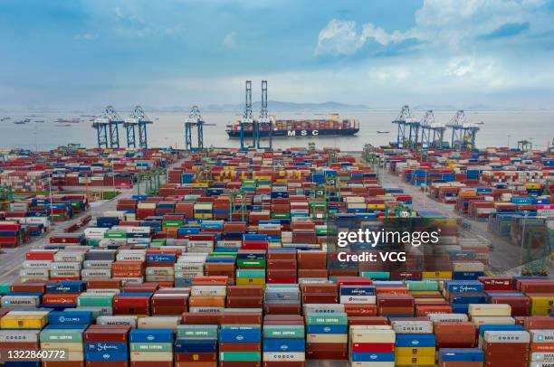 Aerial view of shipping containers sitting stacked at Nansha Port, operated by Guangzhou Port Group Co., on June 8, 2021 in Guangzhou, Guangdong...