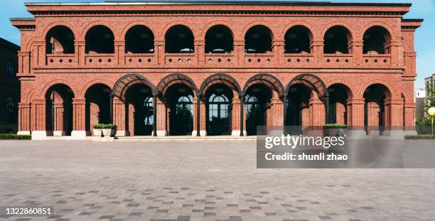 city square in front of modern buildings - brick arch stock pictures, royalty-free photos & images