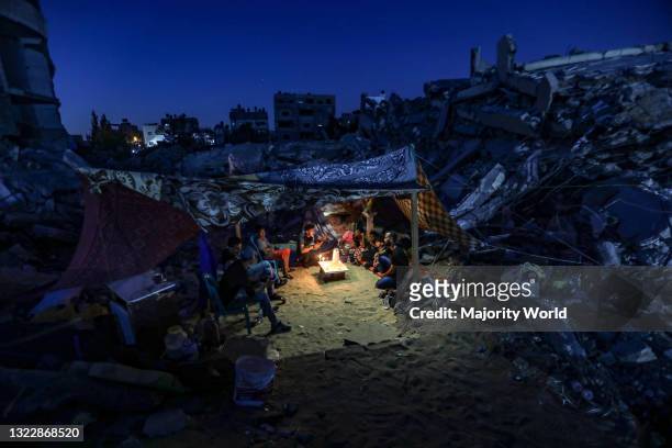 Palestinian family lives in a tent on the rubble of their destroyed home in the northern Gaza Strip. Gaza City.