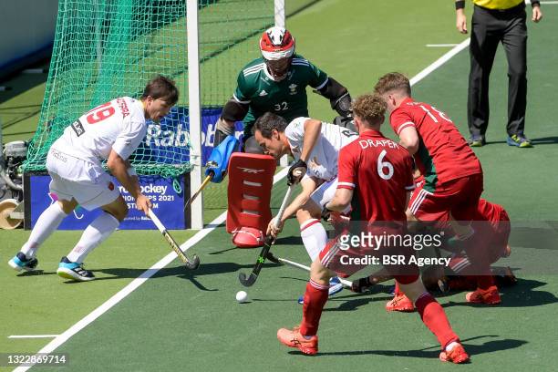 Jose Basterra of Spain, Ieuan Tranter of Wales, Alvaro Iglesias of Spain and Jacob Draper of Wales during the Euro Hockey Championships match between...
