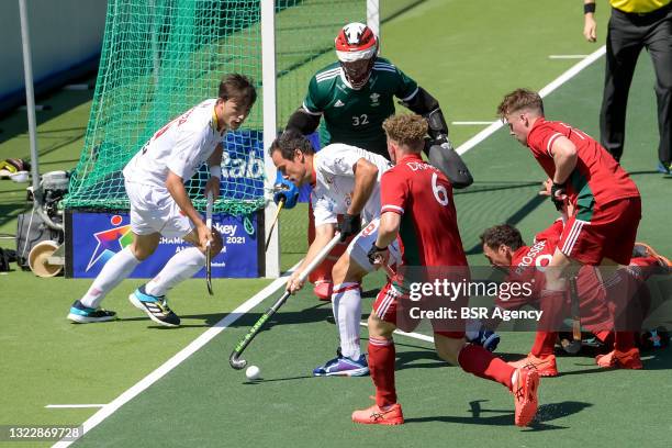 Jose Basterra of Spain, Ieuan Tranter of Wales, Alvaro Iglesias of Spain and Jacob Draper of Wales during the Euro Hockey Championships match between...