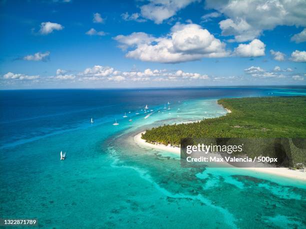 aerial view of island and sea against blue sky,dominican republic - domminican stock pictures, royalty-free photos & images