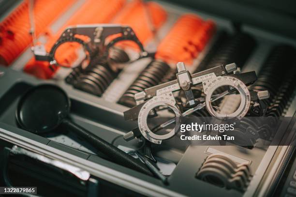 optometrist diopter tool in an optician laboratory optician's case full of eyesight testing lenses - eye scan stock pictures, royalty-free photos & images
