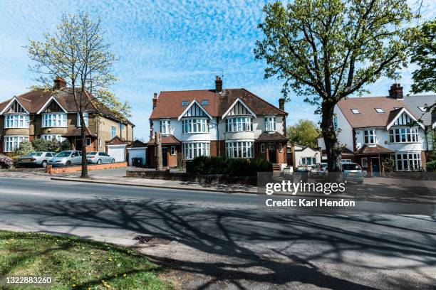 a daytime view of a suburban road in london on a sunny day - stock photo - uk suburb stock pictures, royalty-free photos & images