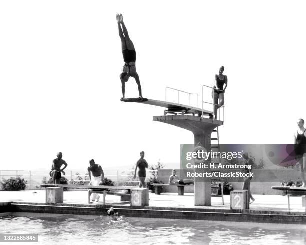 1930s 1935 Man Doing Handstand On Diving Board Swimming Pool The Opelbad In Neroberg Hill Overlooking Wiesbaden Germany.