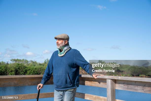 a man wearing a protective neck collar - protective collar stock pictures, royalty-free photos & images