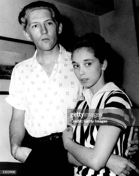 American "rock n'' roll" singer and pianist Jerry Lee Lewis and his fifteen year-old wife Myra pause for a photograph May 23, 1958 at the Westbury...